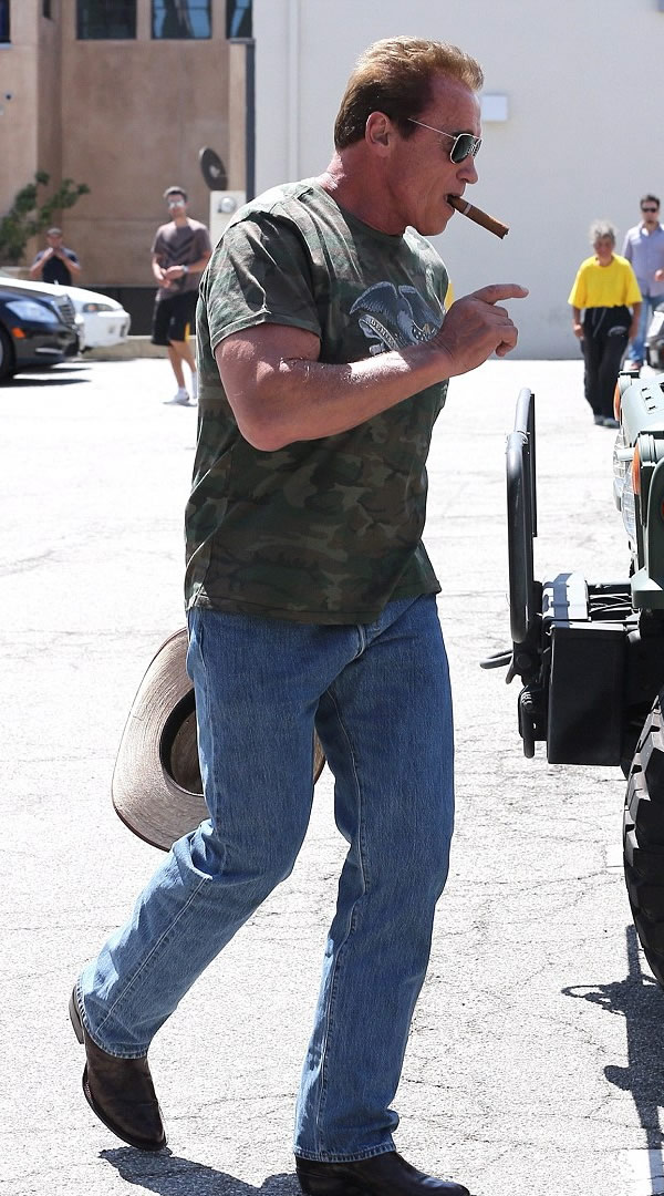Arnold Schwarzenegger looked like a true-blue American as he stepped out for lunch at Cafe Roma in Beverly Hills on Saturday with a cowboy hat and cowboy boots on.