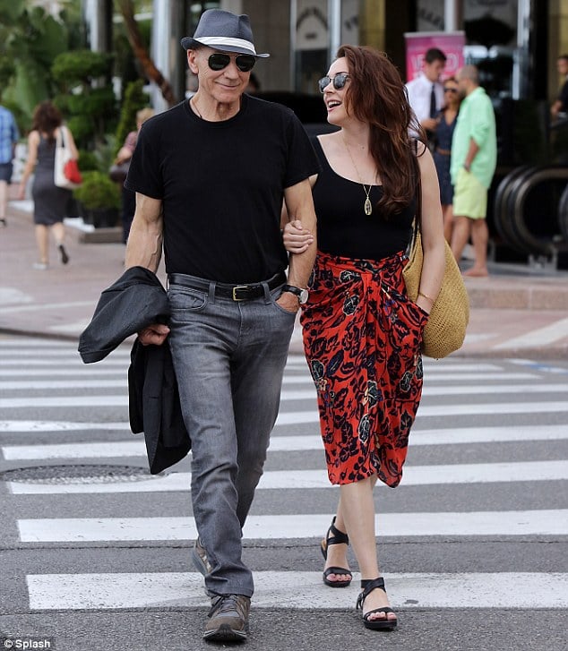 Sir Patrick Stewart wears tight T-shirt and fedora hat as he shops in Cannes