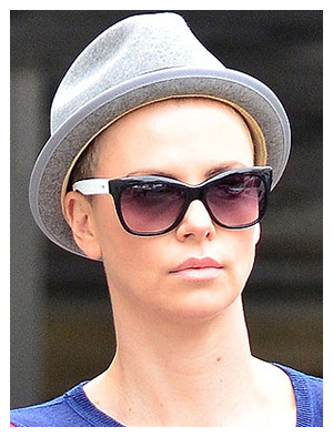 Charlize Theron is convinced her son thinks she is a professional cowboy.