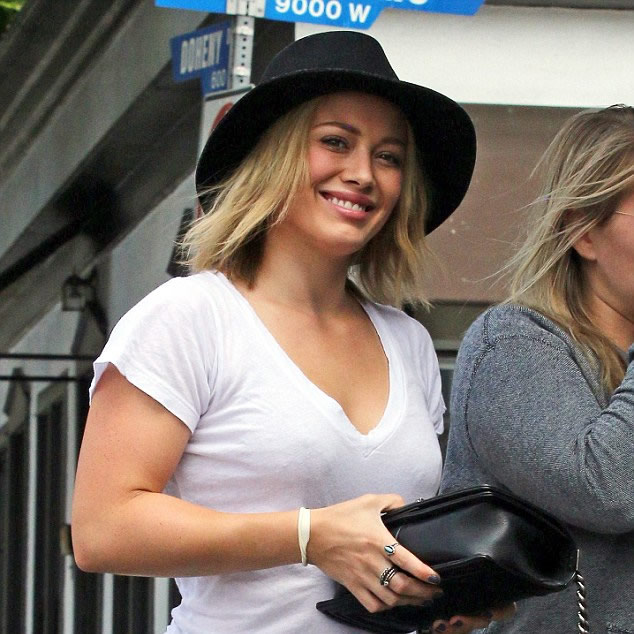 Hilary Duff slips into form-fitting jeans and a chic felt fedora